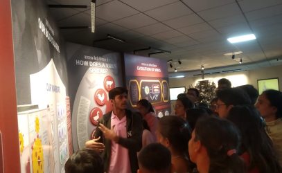 Family-members-being-explained-an-exhibit-in-VIH-exhibition